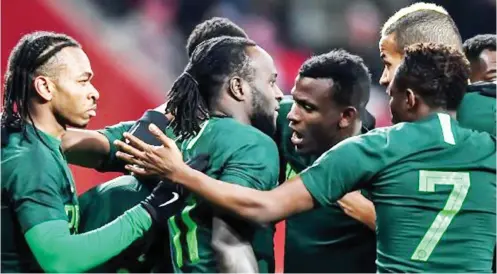  ??  ?? Super Eagles players celebrate Victor Moses' penalty goal against Poland on Friday in an internatio­nal friendly. Nigeria won 1-0.