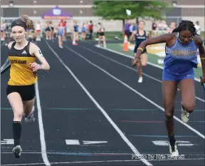  ?? Photo by Kris Everett ?? Adrienne McKean edged out Homestead’s Anna Ream by .03 seconds to help the South Adams 4x100 M Relay team finish third and advance to next week’s regional. Also on the team for the Starfires were Alison Smith, Brooklyn Bixler and Emmerson Smith.