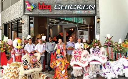  ??  ?? (From left) Justin Robinson, Djohan Rozario, Jay Selvan, Cho Moon Sung, Thomas Ling and Eric Goh pose for s group photo after the grand opening ceremony of BBQ Chicken at Miri Times Square.