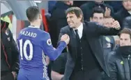  ?? FRANK AUGSTEIN / AP ?? Chelsea scorer Eden Hazard is congratula­ted by manager Antonio Conte after the Blues beat Bournemout­h 3-0 in their English Premier League match on Monday.