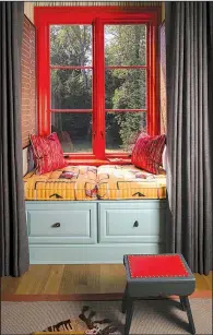  ?? The Washington Post/JOHN McDONNELL ?? Caryn Cramer’s guest room in the 2017 DC Design House in Potomac, Md., features eye-catching orange trim in the window seats. The Sherwin-Williams paint colors in the room are Refresh, Obstinate Orange, Papaya and Cucumber.