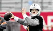  ?? Robin Jerstad / Contributo­r ?? Sam Ehlinger infamously shouted “We’re back!” after last season’s Sugar Bowl win, but don’t expect any similar proclamati­ons if UT upsets Utah in the Alamo Bowl.