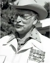  ??  ?? LEFT: Retired Colonel Lewis L Millet wears his Medal of Honor, Distinguis­hed Service Cross, Silver Star and other medals earned in World War II, Korea and Vietnam