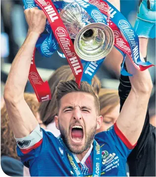  ??  ?? Graeme Shinnie celebrates lifting the Scottish Cup with Inverness Caley Thistle in 2015, he hopes for a similar outcome today in the red of the Dons (below)