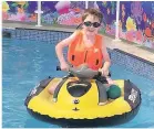  ??  ?? WATER BOY Jamie McCarthy, seven, on a mini jet-ski for kids to use in the pool