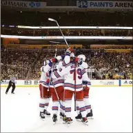  ?? Kirk Irwin / Getty Images ?? The Rangers celebrate Chris Kreider’s winning goal during the third period in Game 6 of a first-round playoff series against the Pittsburgh Penguins on Friday.