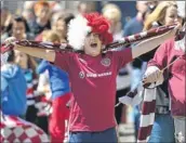  ?? Main picture: Andrew Milligan/pa Wire ?? CUP JOY: Jubilant fans were on the streets from the Royal Mile to Gorgie Road to see the Hearts team with the cup on board the open-top bus.