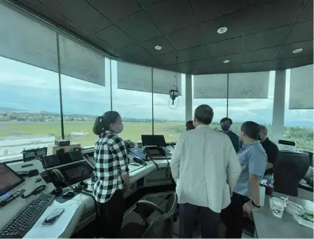  ?? PHOTOGRAPH COURTESY OF DPWH ?? OFFICIALS from the Davao Internatio­nal Airport Authority inspect tower equipment as the agency has been officially launched on Friday.