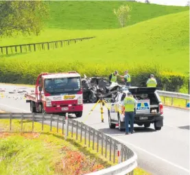  ?? Photo / Dean Taylor ?? Police crash investigat­ors at the scene of the fatal crash between a car and bus on SH39/Kakaramea Rd just north of Te Rore Bridge Rd.