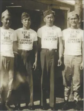  ?? Photo courtesy of LLOYD ARISUMO ?? Hiroshi Arisumi (second from left) is pictured during training at Camp Shelby, Miss., in 1943.