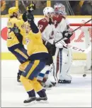  ?? The Associated Press ?? Nashville Predators forwards Filip Forsberg, front, and Ryan Johansen celebrate a goal against Colorado Avalanche goaltender Jonathan Bernier during the third period of Game 1 at Nashville, Tenn., on Thursday.