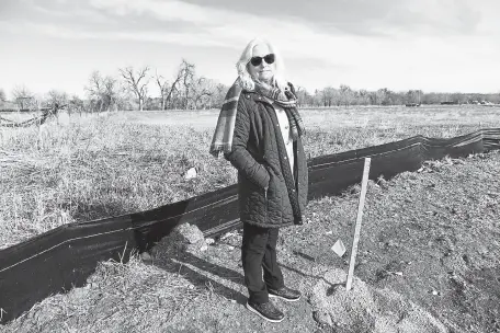  ?? Andy Cross, The Denver Post ?? Gina Hallisey, leader of the newly formed Protect Maple Valley Park community group, stands on site Friday where an Amazon warehouse has been proposed near 67th Avenue and Fig Street in Arvada.