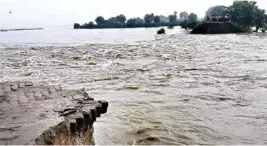  ??  ?? A damaged dam in flood-affected Gopalganj, Bihar, on Wednesday