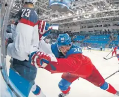  ?? | PETR DAVID JOSEK/AP ?? Despite losing to Team USA in the quarterfin­als, Czech defenseman Michal Rozsival (right) said he enjoyed his Olympic experience.