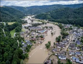  ?? MICHAEL PROBST — THE ASSOCIATED PRESS ?? The Ahr river floats past destroyed houses in Insul, Germany, Thursday, July 15. Due to heavy rain falls the Ahr river dramatical­ly went over the banks the evening before.