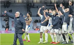  ?? AFP ?? Stevenage manager Steve Evans, left, and his players celebrate their win against Aston Villa in the FA Cup third round at Villa Park.