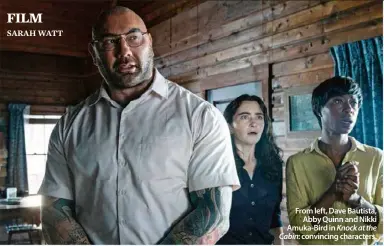  ?? ?? From left, Dave Bautista, Abby Quinn and Nikki Amuka-Bird in Knock at the Cabin: convincing characters.