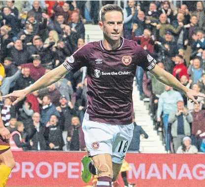  ??  ?? Steven MacLean celebrates after scoring Hearts’ first goal in the cup win over Motherwell.