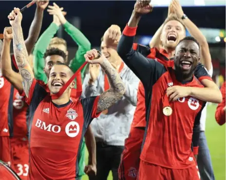  ?? RENÉ JOHNSTON/TORONTO STAR FILE PHOTO ?? Strikers Sebastian Giovinco and Jozy Altidore led the cheers after wrapping up the Canadian championsh­ip — step one for Toronto FC in 2017.