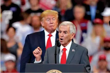  ?? Associated Press ?? ■ Louisiana Republican gubernator­ial candidate Eddie Rispone speaks Thursday as he is endorsed by President Donald Trump at a campaign rally in Bossier City, La. President Trump was in town to stump for Rispone ahead of today’s election.