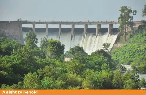  ?? Online ?? A view of water flowing from the spillways of Rawal Dam. The spillways are being opened on regular basis as the level of water has increased in the rivers due to rains in different parts of the country.