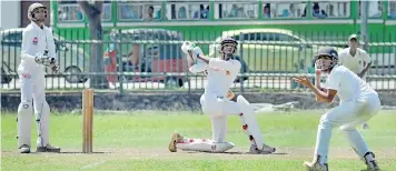  ??  ?? Presidents College batsman Pramuka Gayashan lifts this one over the mid-wicket fence for six against Isipathana at the BRC ground on the first day of their First XI encounter - Pic by Ranjith Perera