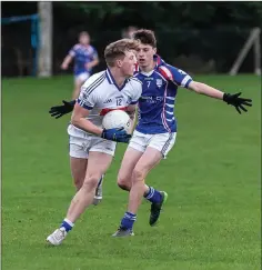  ??  ?? Éire Óg’s Dan Clarke looks to get away from Naomh Eoin’s TomO’Shea.