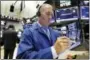  ?? RICHARD DREW — THE ASSOCIATED PRESS ?? Trader Timothy Nick works on the floor of the New York Stock Exchange Monday.