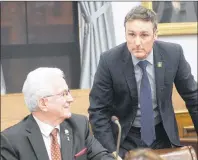  ?? MITCH MACDONALD/THE GUARDIAN ?? Opposition MLA Jamie Fox, right, shown talking to independen­t MLA Bush Dumville in the legislativ­e assembly recently, raised questions Thursday about ammunition found at Colonel Gray High School.