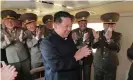  ?? Photograph: KCNA VIA KNS/AFP/ ?? North Korean leader Kim Jong-un applauds as he observes what state media said was the test-fire of a new type of weapon.