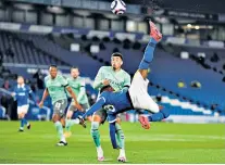  ??  ?? At full stretch: Brighton’s Yves Bissouma tries an acrobatic overhead kick that went over the bar