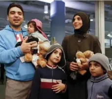  ?? MARK BLINCH/REUTERS FILE PHOTO ?? Syrian refugees arrive in Toronto in December. Canada will be a key presenter at an upcoming UN conference on resettleme­nt issues.