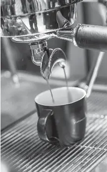  ?? TAYLOR WEIDMAN/BLOOMBERG NEWS ?? An espresso machine at a Starbucks coffee shop in Phnom Penh, Cambodia. The company has more than 25,000 stores globally and serves 90 million customers each week.