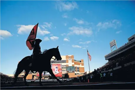  ?? [SARAH PHIPPS/ THE OKLAHOMAN] ?? Bullet celebrates a touchdown during a 2018 game. The famous horse was originally sitting out OSU games this season. Instead, Bullet will ride like normal.