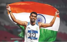  ?? AFP ?? India’s Dharun Ayyasamy celebrates after winning the silver medal in the final of the men’s 400-metre hurdles.