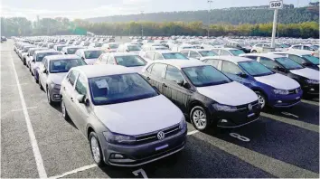  ?? — Reuters ?? Volkswagen Polo models are parked outside the company’s plant in Pamplona, Spain.