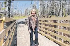  ?? ROSALIE MACEACHERN PHOTO ?? Sally O’Neill, co-coordinato­r of Active Pictou County, on the bridge along the Old Foster Trail in Stellarton.