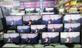  ?? AHN yoUNG‑JooN — THe ASSoCiATeD PReSS ?? TV screens show file footage of a similar North Korea’s ballistic missile that North Korea claimed to have launched from underwater at the yongsan electronic store in Seoul, South Korea, Wednesday. A North Korean ballistic missile fired from a...