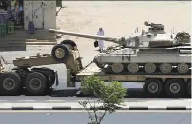  ?? Hasan Jamali / Associated Press ?? An army tank is transporte­d in the city of Najran, Saudi Arabia, near the Yemen border.