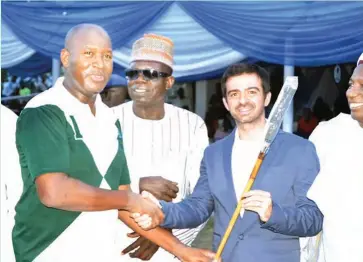  ?? Minister of Aviation and Patron of Abuja Rubicon, Senator Hadi Sirika (left) receives his prize from the Argentine Ambassador, His Excellency Juan Manuel Ortin. In the middle is the cup sponsor, Dawule Baba during the prize presentati­on ceremony in Kaduna ??