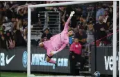  ?? ?? Angel City FC goalkeeper Didi Haracic leaps to block a goal attempt by the Portland Thorns during the first half of Friday's NWSL match at Banc of California Stadium.