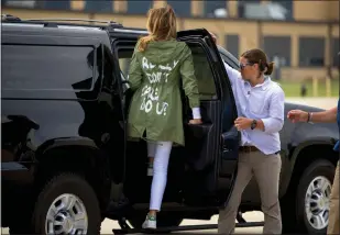  ?? ANDREW HARNIK — THE ASSOCIATED PRESS, FILE ?? Former first lady Melania Trump climbs into a motorcade wearing a jacket that says “I really don't care, do u?”