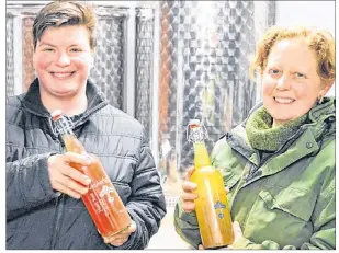  ?? DAVE STEWART/THE GUARDIAN ?? Verena Varga, left, and Amy Smith, co-owners of Heart Beet Organics farm in Darlington, are all smiles after the provincial minister of finance lifted a liquor inspector’s warning to a Charlottet­own restaurant which was selling kombucha produced by the...