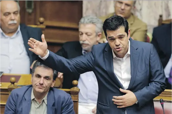  ?? THANASSIS STAVRAKIS/ ASSOCIATED PRESS ?? Greek Prime Minister Alexis Tsipras in parliament Thursday: Even with approval of the deal with creditors, the situation is far from resolution.