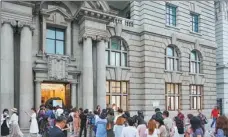  ?? PROVIDED TO CHINA DAILY Impression Sunrise. ?? Visitors wait in a line in front the Bund One Art Museum in downtown Shanghai for the exhibition,