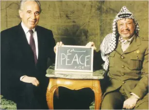  ?? (Reuters) ?? THIS UNDATED picture distribute­d by the Palestinia­n Authority shows former Palestinia­n leader Yasser Arafat (right) with Shimon Peres.