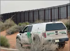  ?? PHOTO/RUSSELL CONTRERAS ?? In this Jan. 5, 2016, file photo, a U.S. Border Patrol vehicle drives next to a U.S-Mexico border fence in the booming New Mexico town of Santa Teresa. AP