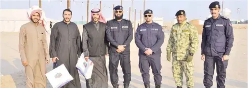  ??  ?? KUWAIT: The Kuwait Fire Services Directorat­e (KFSD) launched a security campaign Friday night at the Mutla’a camps to raise safety awareness. It was carried out in cooperatio­n with EQUATE and the Kuwait National Guard.