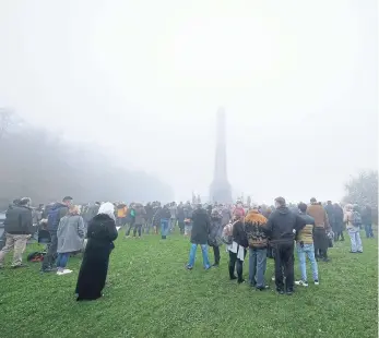  ?? ?? This year’s service at the Mount was shrouded by fog.