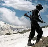  ??  ?? Flashpoint: An Indian soldier on patrol at the Himalayan border with Pakistan